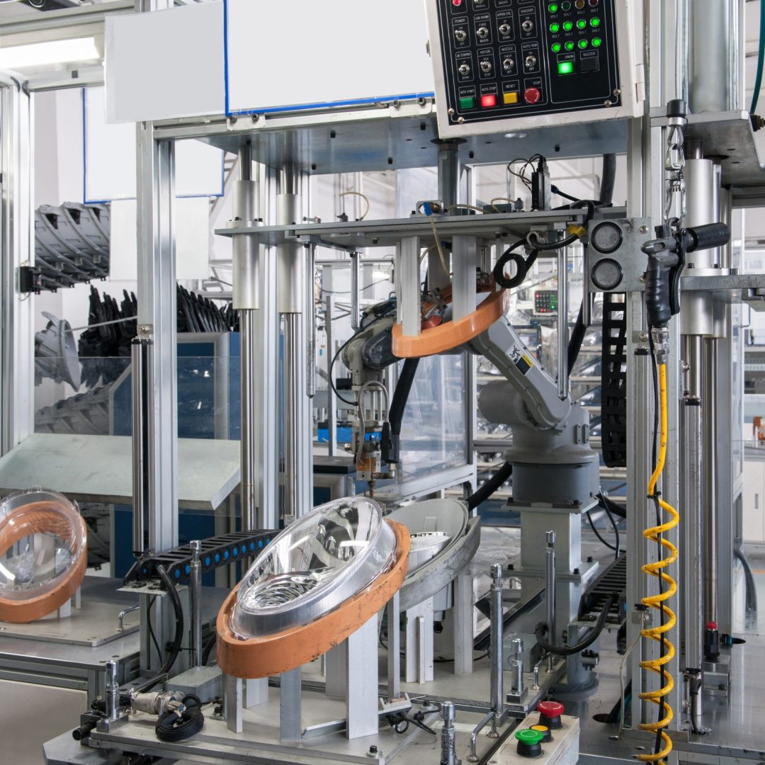 equipment for the manufacture of car headlights assembling car headlights with hot seal. factory equipment of quality control of automobile headlamps